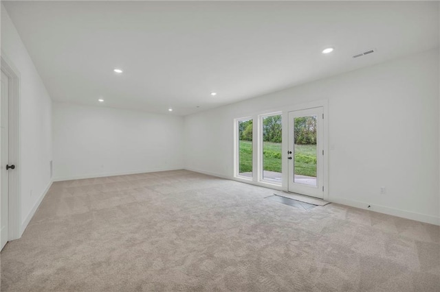 502 Seventh St, Smithville, MO 64089 - spare room featuring recessed lighting, light colored carpet, and baseboards