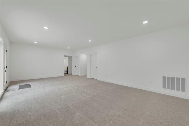 502 Seventh St, Smithville, MO 64089 - unfurnished room with recessed lighting, light carpet, and baseboards