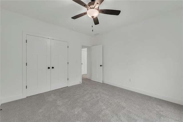 502 Seventh St, Smithville, MO 64089 - unfurnished bedroom with carpet, a closet, baseboards, and ceiling fan