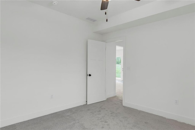 502 Seventh St, Smithville, MO 64089 - spare room featuring light colored carpet, ceiling fan, baseboards, and a smoke detector