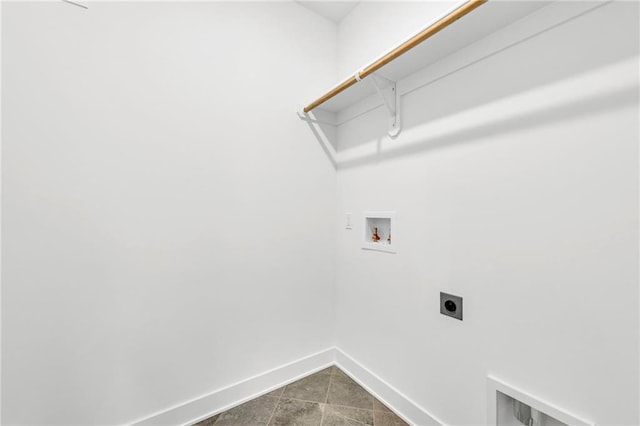 502 Seventh St, Smithville, MO 64089 - washroom with electric dryer hookup, baseboards, washer hookup, and dark tile patterned floors