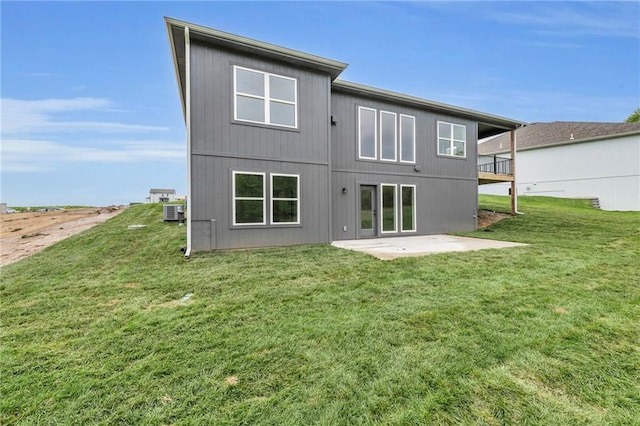502 Seventh St, Smithville, MO 64089 - rear view of house featuring a patio area, a lawn, and central air condition unit