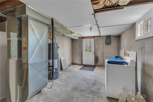 below grade area with heating unit, washer / dryer, and water heater