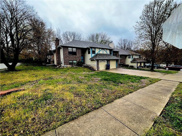 8200 Chas Cir, Pleasant Valley, MO 64068 - view of front of home with a front yard, concrete driveway, a chimney, an attached garage, and brick siding
