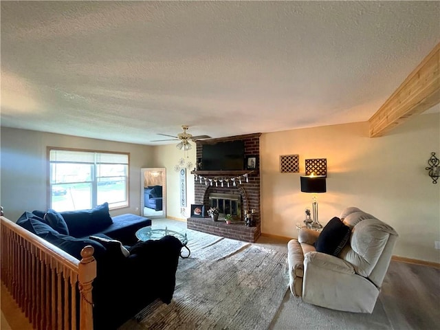 8200 Chas Cir, Pleasant Valley, MO 64068 - carpeted living area with beam ceiling, baseboards, a fireplace, and ceiling fan