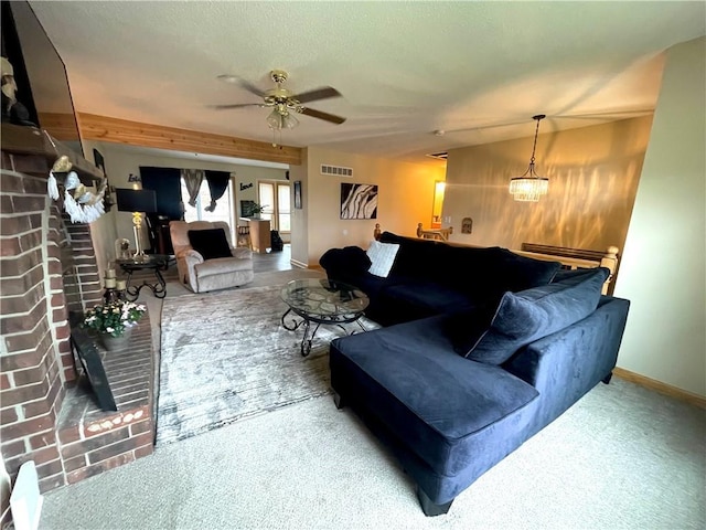 8200 Chas Cir, Pleasant Valley, MO 64068 - living room with carpet flooring, visible vents, baseboards, a fireplace, and a ceiling fan