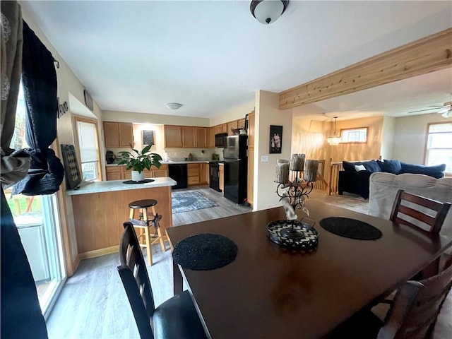 8200 Chas Cir, Pleasant Valley, MO 64068 - dining space with beamed ceiling, a ceiling fan, and light wood finished floors