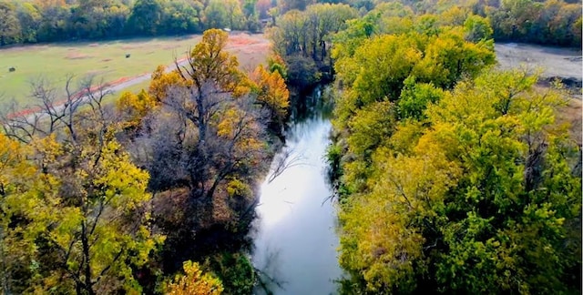 33345 W 95th St, De Soto, KS 66018 - drone / aerial view of a nearby body of water and a heavily wooded area