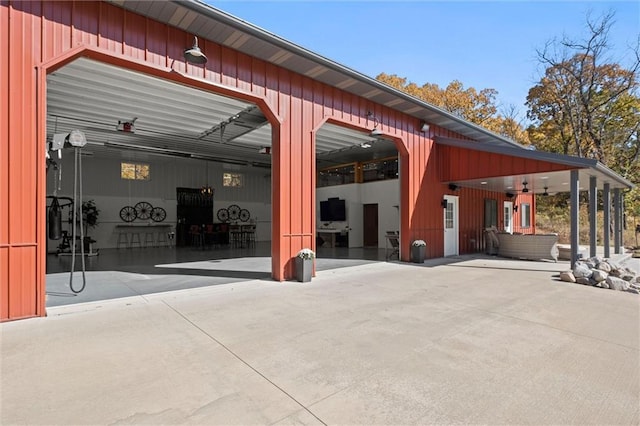 33345 W 95th St, De Soto, KS 66018 - view of patio / terrace featuring a garage and driveway