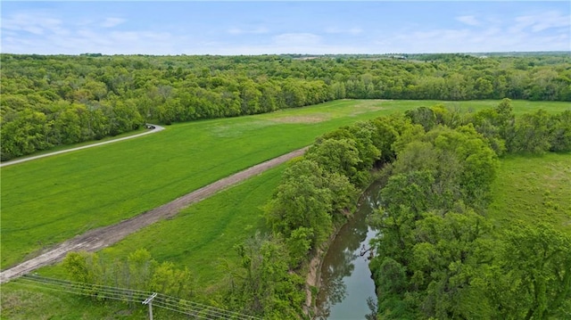 33345 W 95th St, De Soto, KS 66018 - aerial view of property and surrounding area with a nearby body of water and a forest