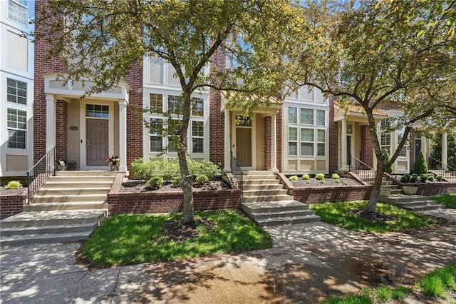 view of front of house featuring brick siding