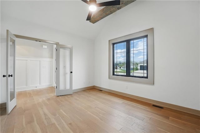 unfurnished bedroom with light wood-style flooring, a ceiling fan, baseboards, and french doors