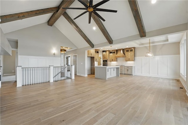 unfurnished living room with high vaulted ceiling, light wood-style flooring, ceiling fan, beam ceiling, and recessed lighting