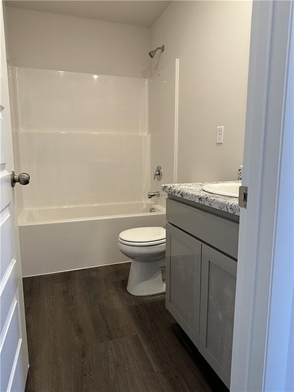37806 W 207th Ter, Edgerton, KS 66021 - bathroom featuring vanity, wood finished floors, toilet, and shower / bathtub combination