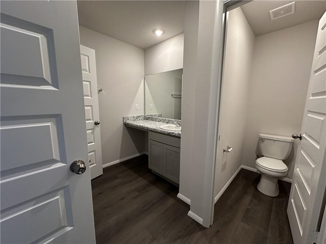 37806 W 207th Ter, Edgerton, KS 66021 - bathroom with wood finished floors, baseboards, vanity, and toilet