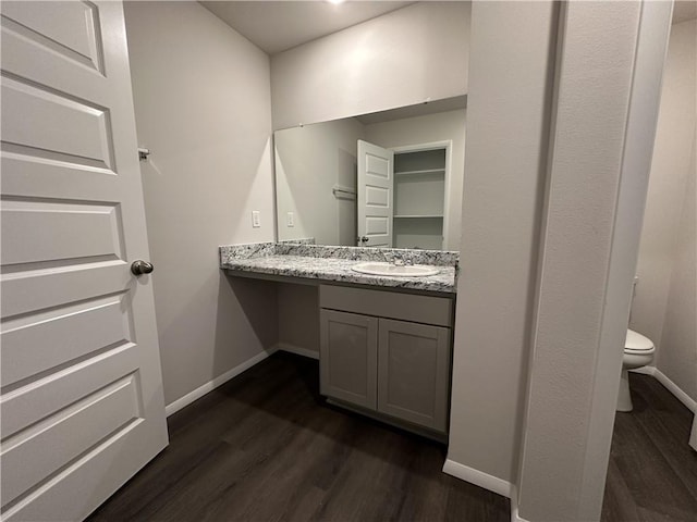 37806 W 207th Ter, Edgerton, KS 66021 - bathroom with wood finished floors, baseboards, toilet, and vanity