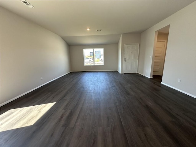 37806 W 207th Ter, Edgerton, KS 66021 - unfurnished living room with baseboards, dark wood-style flooring, lofted ceiling, and recessed lighting