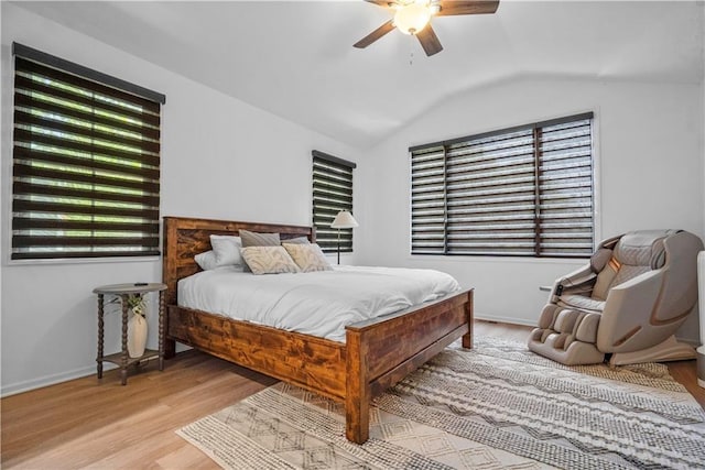 38 Lakeview Ln, Linn Valley, KS 66040 - bedroom featuring wood finished floors, vaulted ceiling, multiple windows, and ceiling fan