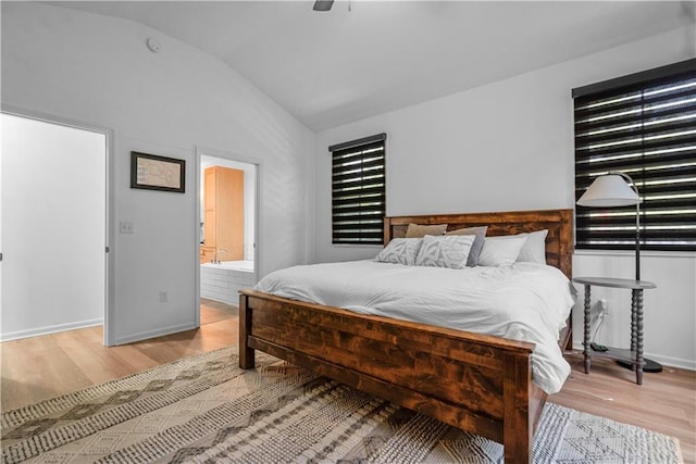 38 Lakeview Ln, Linn Valley, KS 66040 - bedroom featuring light wood finished floors, vaulted ceiling, ceiling fan, and ensuite bathroom