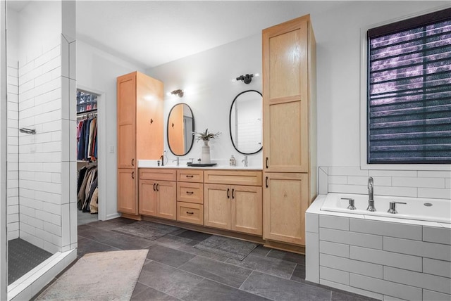 38 Lakeview Ln, Linn Valley, KS 66040 - full bathroom with double vanity, a garden tub, tiled shower, and a spacious closet