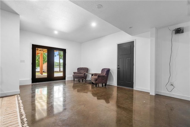 38 Lakeview Ln, Linn Valley, KS 66040 - living area with concrete flooring, a textured ceiling, and recessed lighting