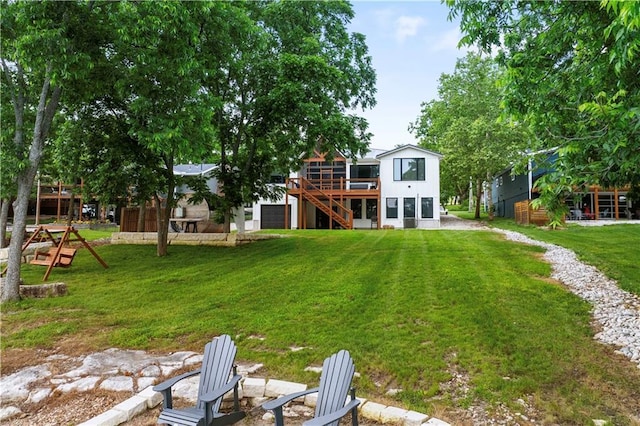 38 Lakeview Ln, Linn Valley, KS 66040 - rear view of property featuring a deck, stairway, and a lawn