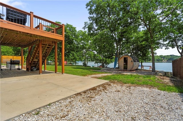 38 Lakeview Ln, Linn Valley, KS 66040 - view of yard featuring a patio area, stairs, and a deck with water view