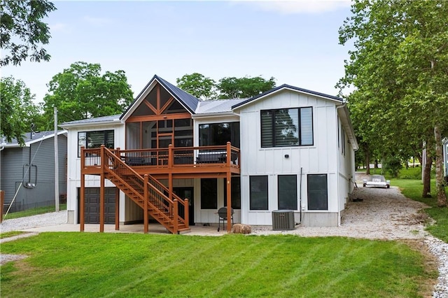 38 Lakeview Ln, Linn Valley, KS 66040 - rear view of property with board and batten siding, stairs, a deck, and a yard