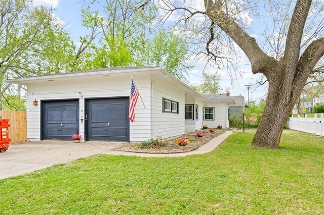 4401 N Holmes St, Kansas City, MO 64116 - exterior space with fence, a yard, and a detached garage