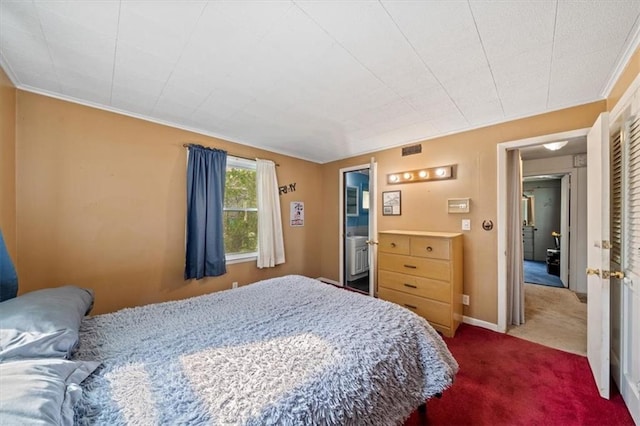 4401 N Holmes St, Kansas City, MO 64116 - bedroom with dark colored carpet, visible vents, and ornamental molding