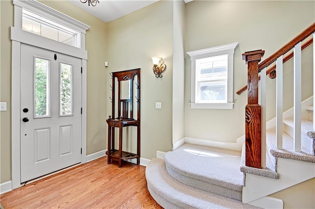 3205 SW Rockbridge Dr, Lees Summit, MO 64081 - entrance foyer featuring baseboards, light wood-type flooring, and stairs
