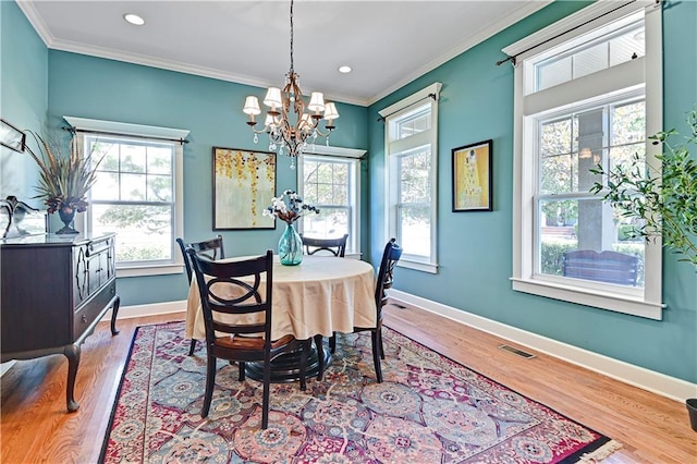 3205 SW Rockbridge Dr, Lees Summit, MO 64081 - dining room featuring visible vents, wood finished floors, baseboards, a notable chandelier, and ornamental molding