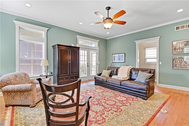 3205 SW Rockbridge Dr, Lees Summit, MO 64081 - living room featuring crown molding, ceiling fan, plenty of natural light, and light wood-style flooring