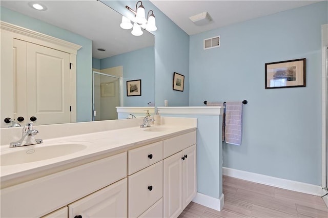 3205 SW Rockbridge Dr, Lees Summit, MO 64081 - full bathroom with visible vents, a sink, and a stall shower