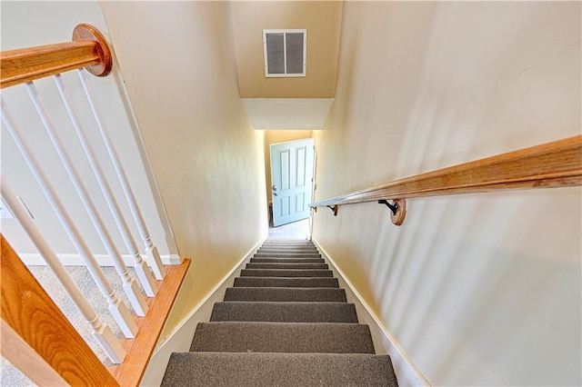 3205 SW Rockbridge Dr, Lees Summit, MO 64081 - stairway with baseboards and visible vents