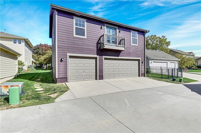 3205 SW Rockbridge Dr, Lees Summit, MO 64081 - view of front of home featuring a garage, driveway, and a balcony