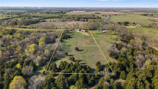birds eye view of property featuring a rural view