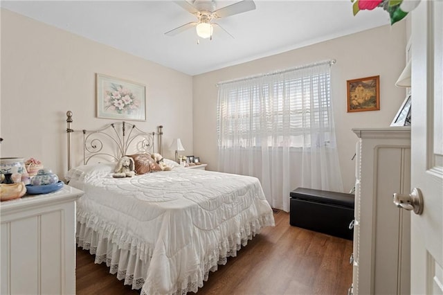 bedroom with wood finished floors and a ceiling fan