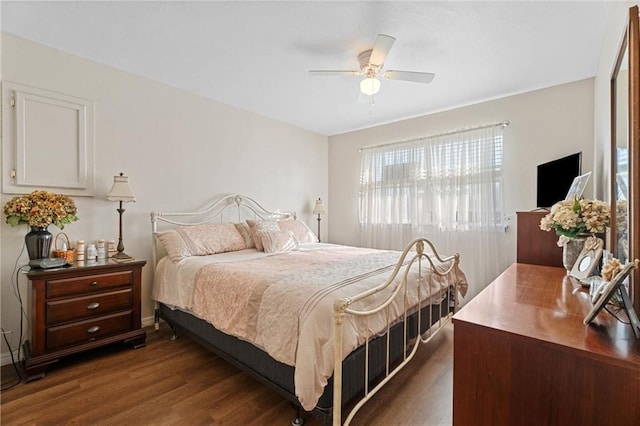 bedroom with dark wood-type flooring and ceiling fan