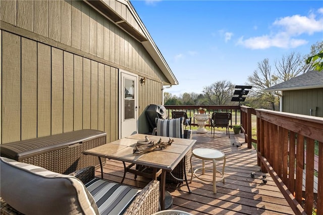 wooden deck featuring outdoor dining area