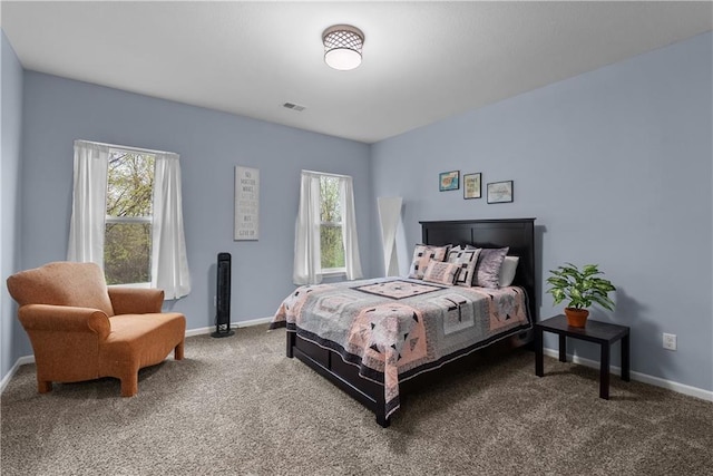 bedroom with carpet, baseboards, multiple windows, and visible vents