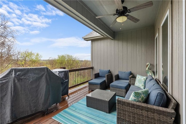 deck featuring an outdoor living space, a grill, and ceiling fan