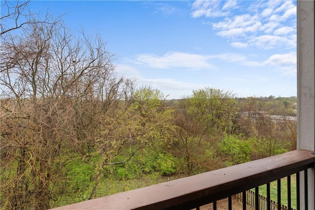 exterior space with a wooded view