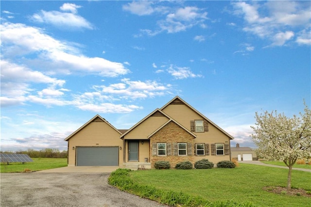 611 NW 1421st Rd, Holden, MO 64040 - view of front facade with a garage, driveway, a front lawn, and solar panels