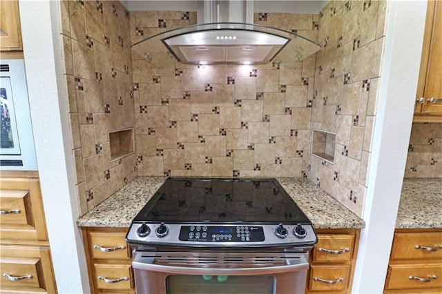 611 NW 1421st Rd, Holden, MO 64040 - kitchen featuring stainless steel electric range, extractor fan, white microwave, light stone counters, and brown cabinets