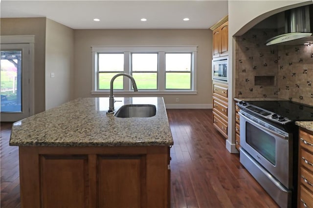 611 NW 1421st Rd, Holden, MO 64040 - kitchen featuring electric stove, wall chimney exhaust hood, a sink, built in microwave, and a center island with sink