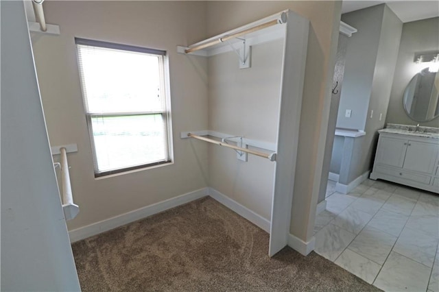 611 NW 1421st Rd, Holden, MO 64040 - walk in closet with light carpet and light marble finish floors