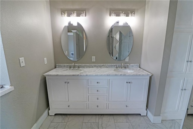 611 NW 1421st Rd, Holden, MO 64040 - full bathroom with marble look tiles, baseboards, and double vanity