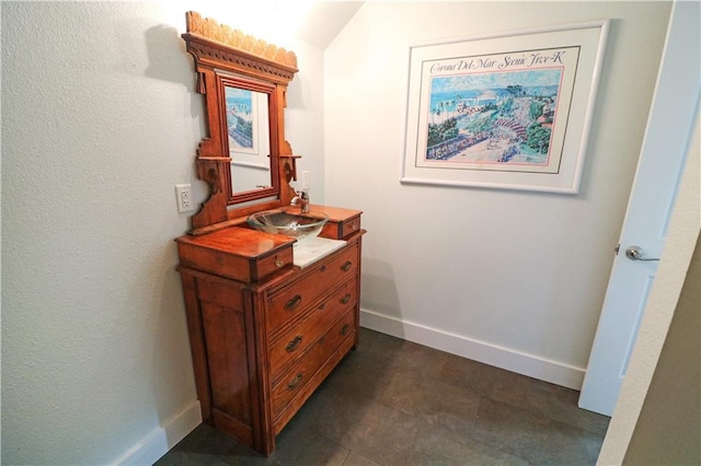 611 NW 1421st Rd, Holden, MO 64040 - hallway with a sink, baseboards, and vaulted ceiling