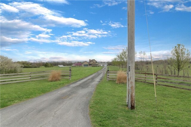 611 NW 1421st Rd, Holden, MO 64040 - view of asphalt driveway featuring a rural view and a gated entry